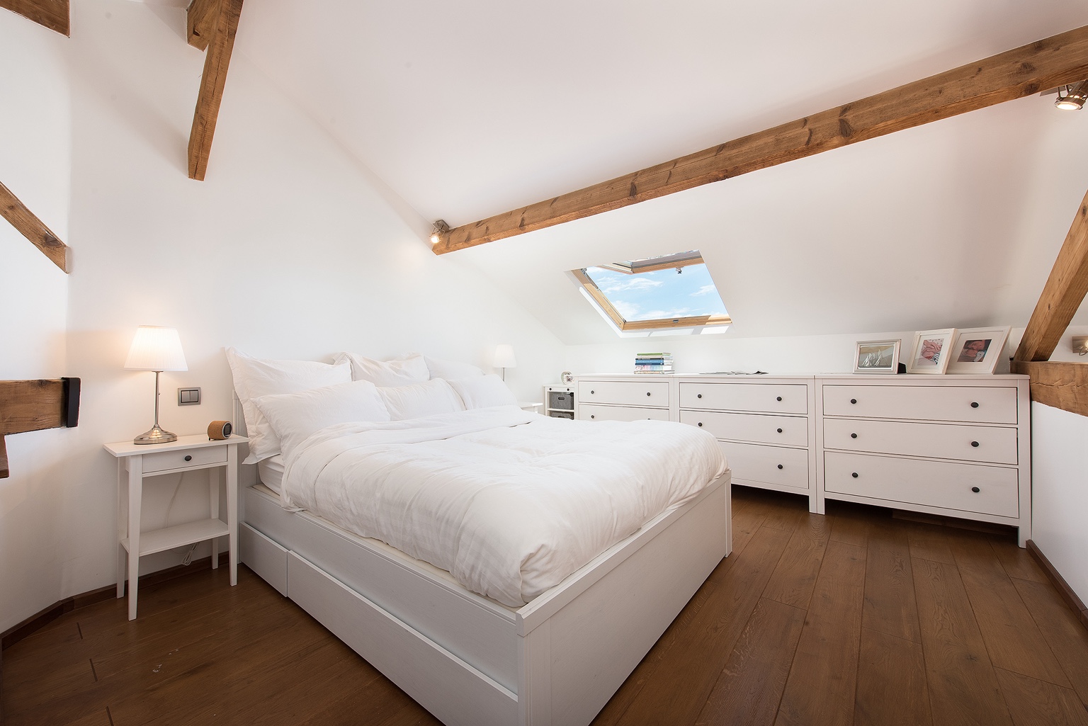 White bedroom under sloping ceiling