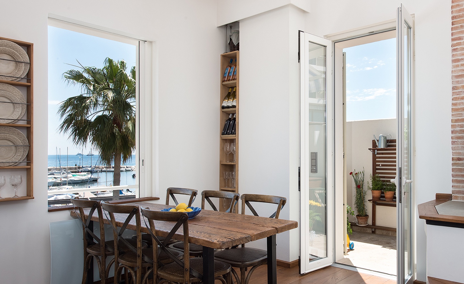 Dining view over the marina and sea